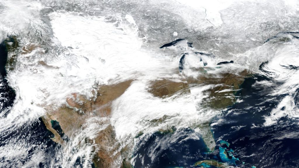 Early Warning Systems Are Quietly Becoming Disaster Insurance A weather satellite view of a storm system over Earth